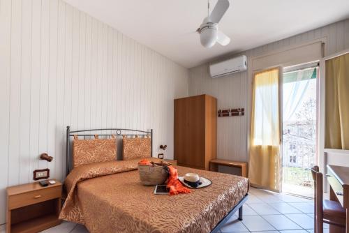 מיטה או מיטות בחדר ב-Albergo Rosa & Cosetta