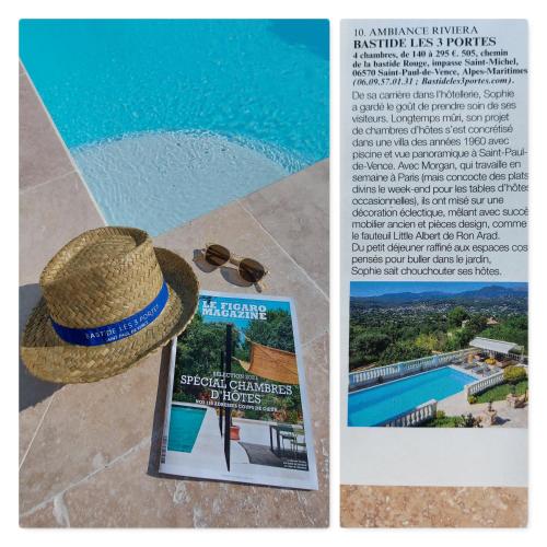 un chapeau de paille et des lunettes de soleil assis à côté d'un magazine dans l'établissement Bastide les 3 Portes, à Saint-Paul-de-Vence