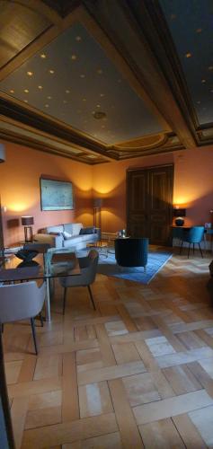a large room with tables and chairs and a ceiling at Belle Epoque Luzern in Lucerne