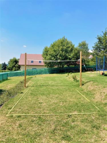 a net on a field with at Apartments Villa Viola in Kovářská