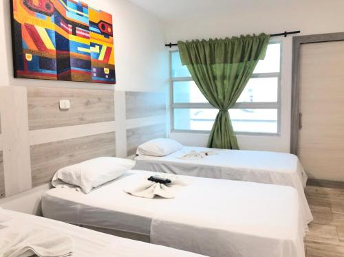 Postel nebo postele na pokoji v ubytování Hotel ibiza Central