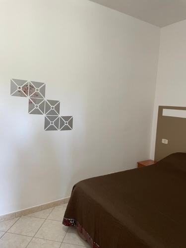 Una cama o camas en una habitación de B&B Adema