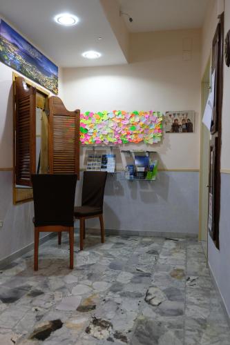 a dining room with two chairs and a table at Bed & Breakfast Il Golfo in Naples
