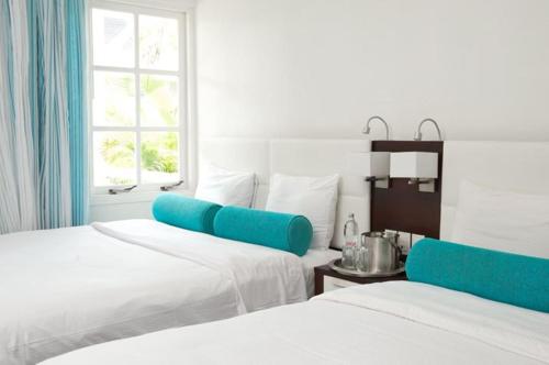 Cama ou camas em um quarto em Trupial Hotel & Casino