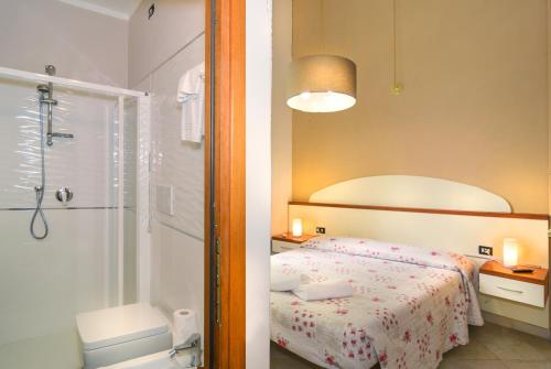 Säng eller sängar i ett rum på Villa Grazia