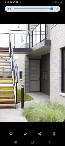 una foto di una casa con garage di Captains Cove Ground Floor Luxury Apartments a Paynesville