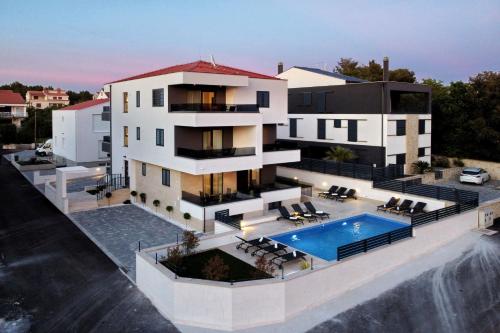 an aerial view of a house with a swimming pool at Villa Ankora 1 with heated pool in Biograd na Moru