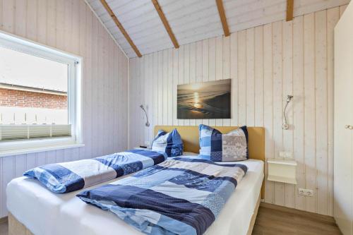 Un pat sau paturi într-o cameră la Haus Deik