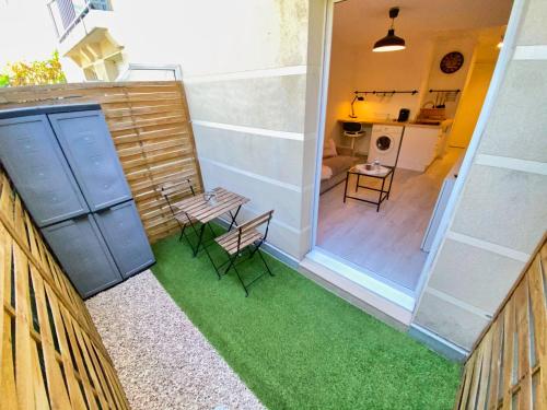 a view of a room with some green grass at Espace Valrose in Nice