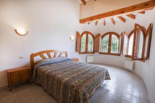 เตียงในห้องที่ Villa Empedrola