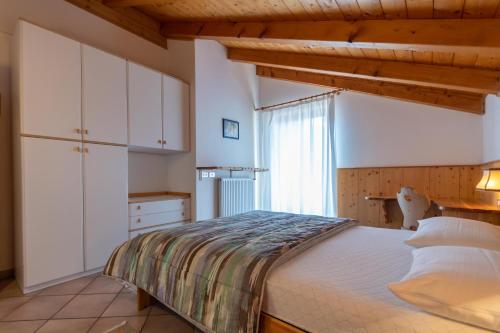 Ένα ή περισσότερα κρεβάτια σε δωμάτιο στο Casa Fanton