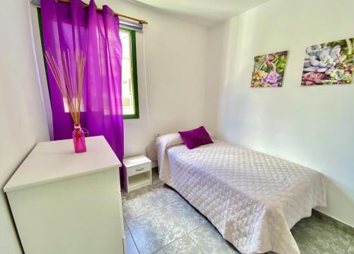 Ένα ή περισσότερα κρεβάτια σε δωμάτιο στο Home2Book Relax Apartment Buenavista