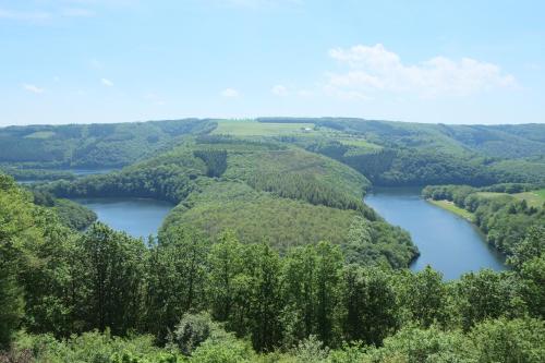 an aerial view of a river in a valley at La Diligence in Arsdorf