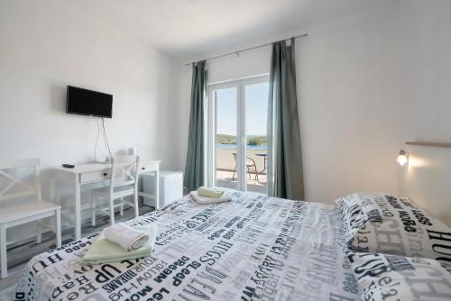 Ένα ή περισσότερα κρεβάτια σε δωμάτιο στο Picić Guesthouse