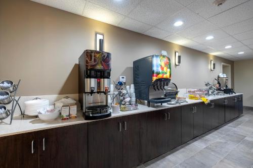 a kitchen with a counter with a coffee maker at Red Roof Inn PLUS+ Tuscaloosa - University in Tuscaloosa