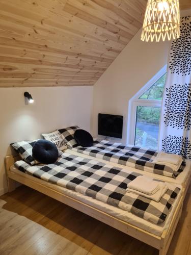 Кровать или кровати в номере Na Hamaku Jacuzzi & Sauna