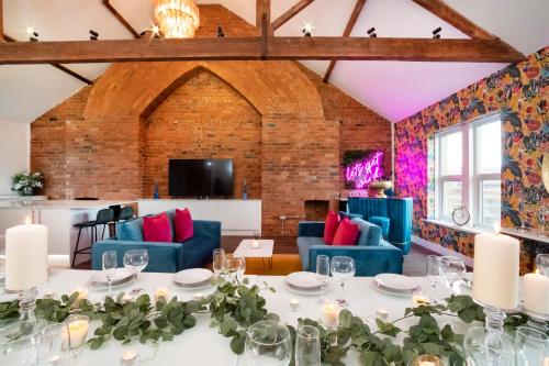 a dining room with a table and blue chairs at Innvigour Bespoke House with Free Parking for 3 Cars in York
