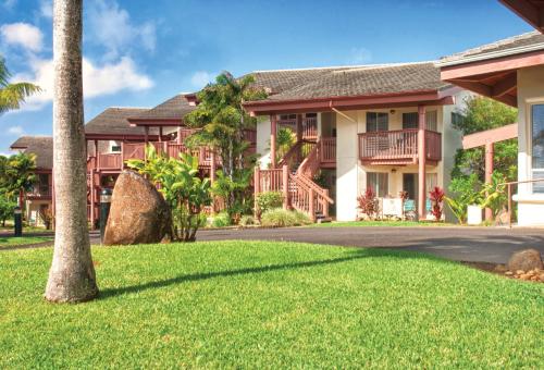 a house with a lawn in front of it at Club Wyndham Shearwater in Princeville
