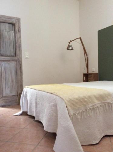 Ένα ή περισσότερα κρεβάτια σε δωμάτιο στο La Maison De Stephanie