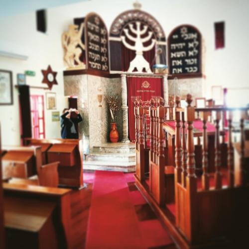 a church with a row of chairs in a room at Branca Gonçalves Belmonte in Belmonte