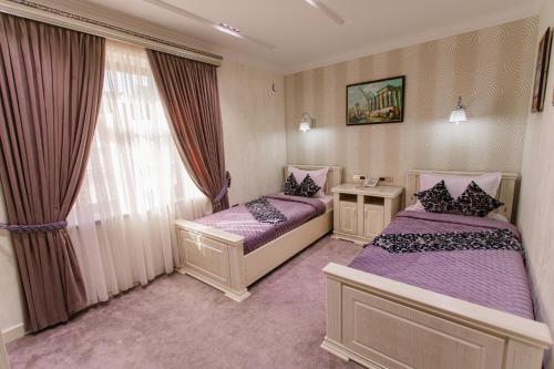 Katil atau katil-katil dalam bilik di Shaxzoda Elite Hotel