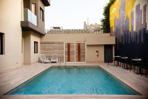 a swimming pool in the middle of a building at Silver Moon Hotel in Abidjan