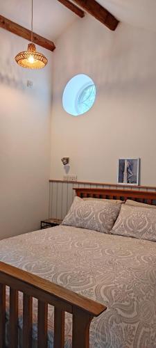a bedroom with a bed with a blue ceiling at Headingley Hideaway in Headingley