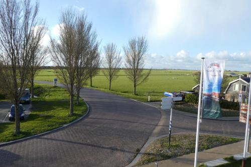 a winding road with a sign on the side of the road at Hotel Workum in Workum