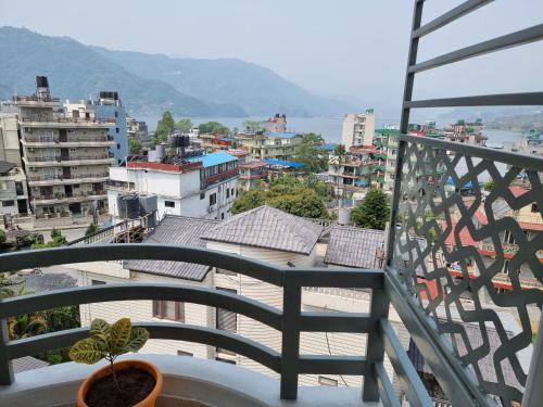 a balcony with a view of a city at Chautari Boutique Hotel in Pokhara