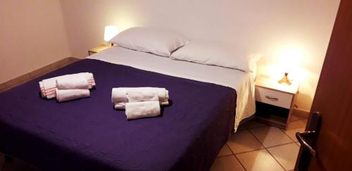 Giường trong phòng chung tại Appartamento Zio Michele - Centro dell'Isola