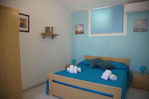 A bed or beds in a room at Giulymar