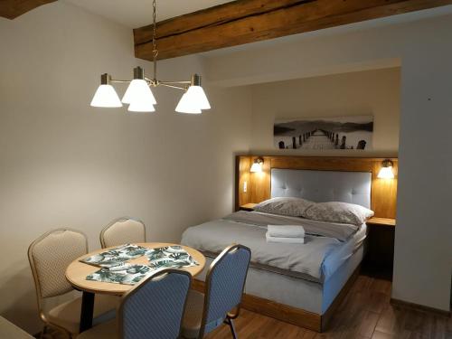Кровать или кровати в номере Podzamcze