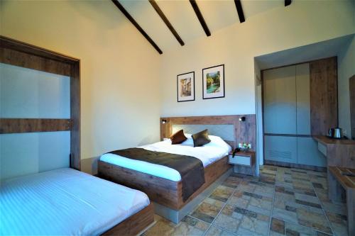 Postel nebo postele na pokoji v ubytování Milyos Hotel