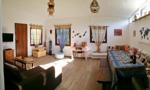 a living room with a couch and a table at La Casa Encantada del Bosque in Icod de los Vinos