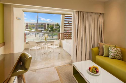 a living room with a couch and a table at Dreams Onyx Resort & Spa - All Inclusive in Punta Cana