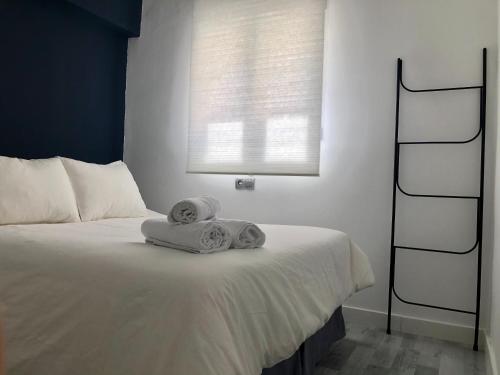Säng eller sängar i ett rum på Apartamento Algazul
