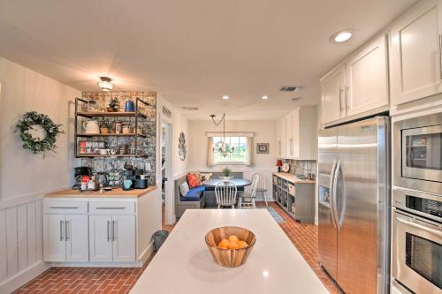 a kitchen with a counter with a bowl of oranges on it at Spacious Getaway about 12 Acres, Views, and Hot Tub! in Strawn