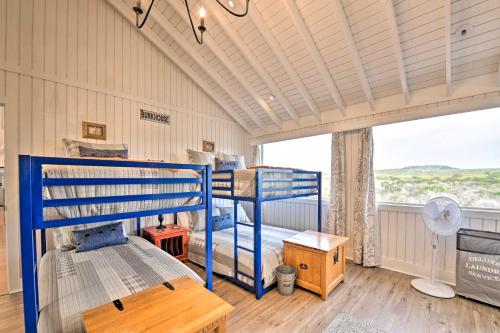 a room with two bunk beds and a window at Spacious Getaway about 12 Acres, Views, and Hot Tub! in Strawn