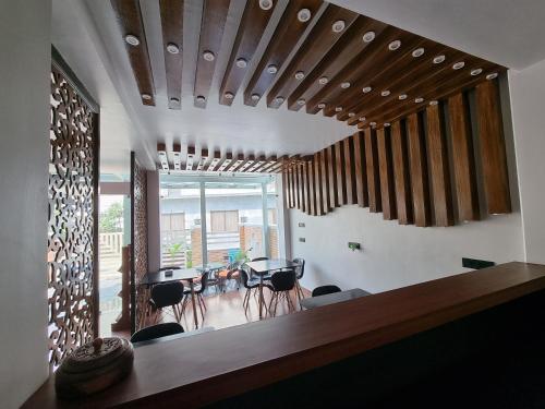 a living room with a table and some chairs at Chautari Boutique Hotel in Pokhara