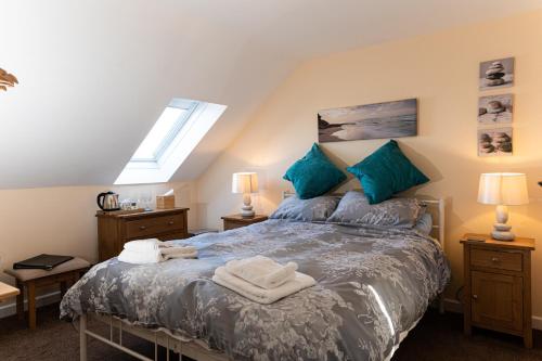 Llit o llits en una habitació de Bosayne Guest House