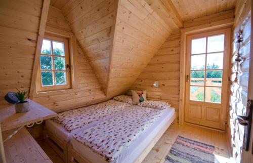 Tempat tidur dalam kamar di Friland