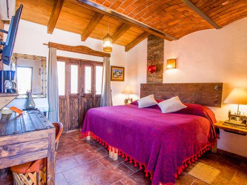 Postel nebo postele na pokoji v ubytování Hotel Mi Pueblito Tapalpa
