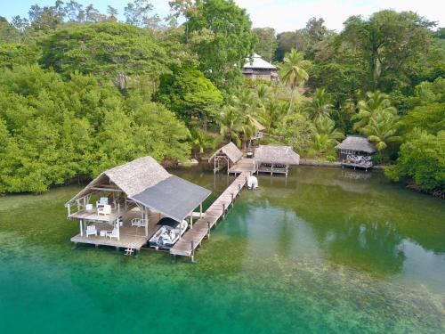 an aerial view of a house in the water at Finca Vela Lodge in Bocas Town