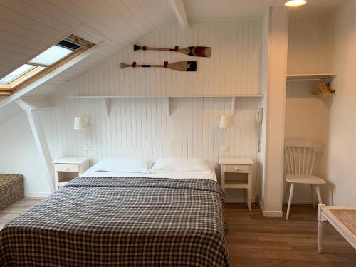 a bedroom with a bed in a attic at Villa Saint Hubert in Nice