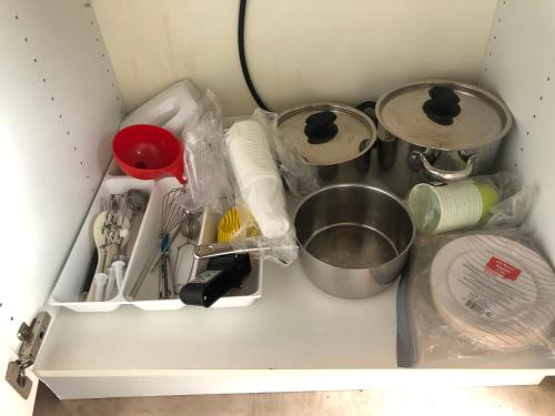 a drawer full of kitchen utensils in a refrigerator at Three Rooms stuga i stugby near National Park in Undenäs