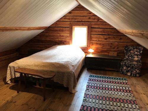 A bed or beds in a room at Lilla Stubbetorp