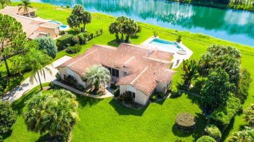 an aerial view of a house with a swimming pool at SWISS 61 - Lake Denise in Clermont