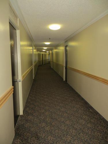 an empty hallway in an office building at Athabasca Valley Inn & Suites in Hinton