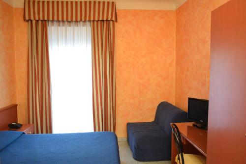 Кровать или кровати в номере Hotel Aurora
