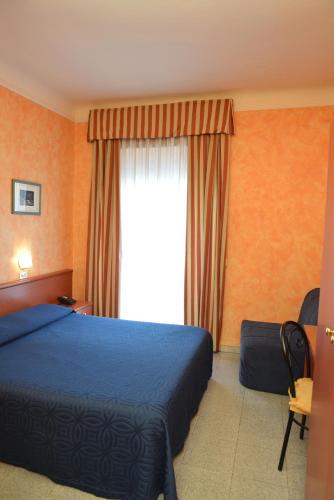 Кровать или кровати в номере Hotel Aurora